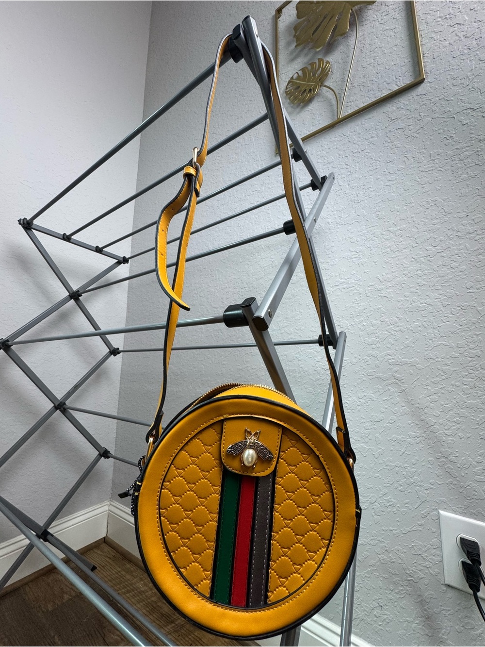 Yellow Quilted Round Crossbody Bag with Striped Detail and Bee Accent